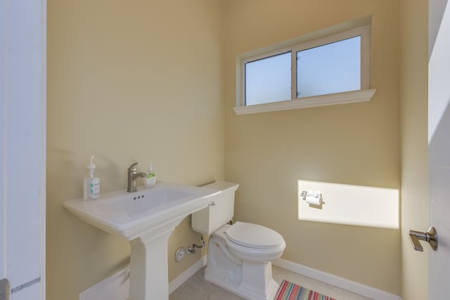 bathroom with tile patterned floors and toilet