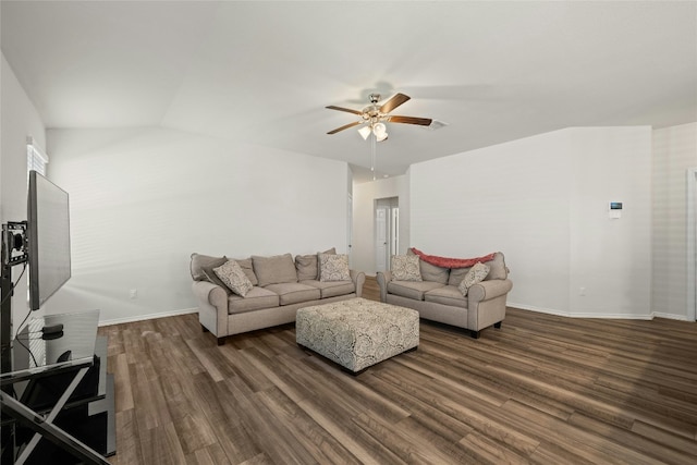 living room with dark wood-type flooring, ceiling fan, and vaulted ceiling