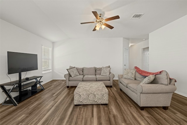 living room with ceiling fan and dark hardwood / wood-style flooring