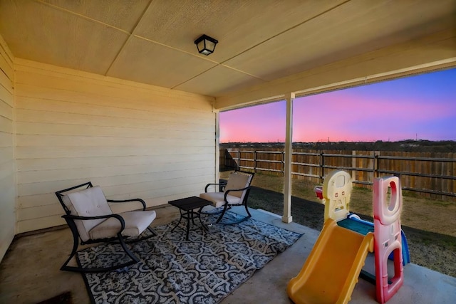 view of patio terrace at dusk