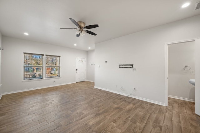 empty room with ceiling fan and wood-type flooring