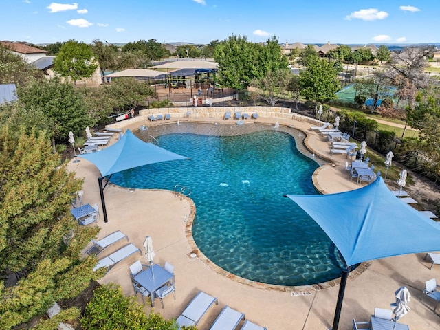 view of swimming pool with a patio area