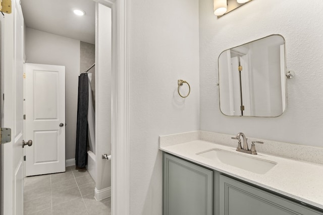 bathroom with tile patterned floors, vanity, and shower / bath combo