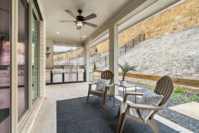 sunroom featuring ceiling fan