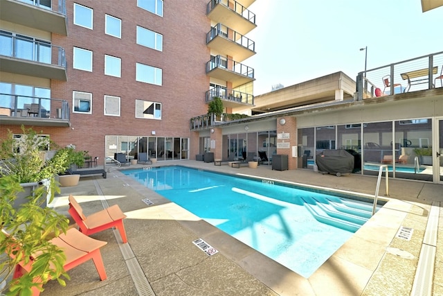 view of pool with grilling area