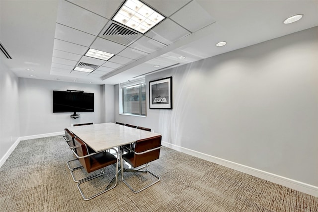 office area with a drop ceiling and carpet