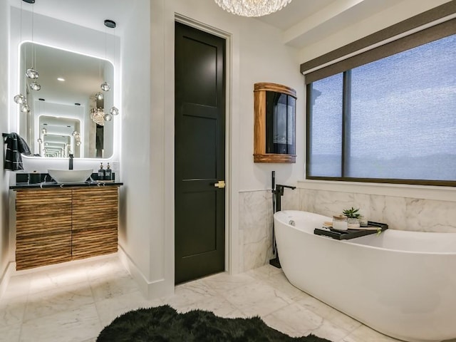 bathroom with vanity and a tub to relax in