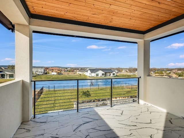 balcony featuring a water view