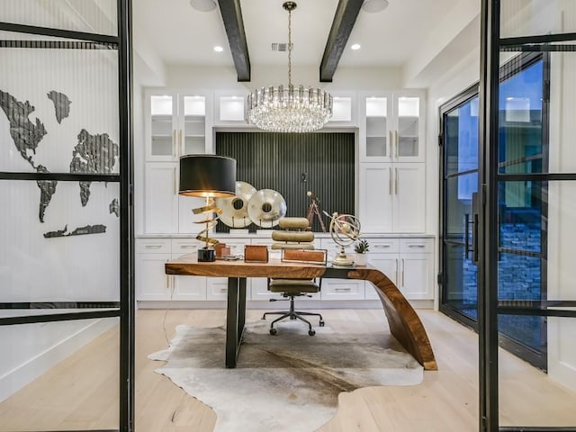 office with a chandelier, beam ceiling, and light hardwood / wood-style flooring