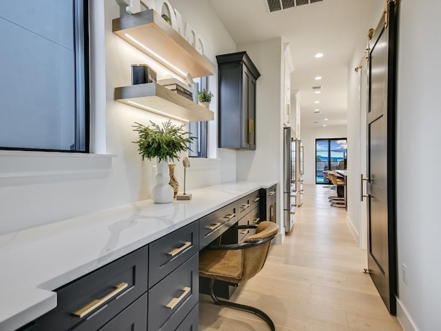 interior space featuring vanity and hardwood / wood-style floors