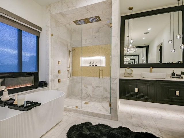 bathroom with shower with separate bathtub and vanity