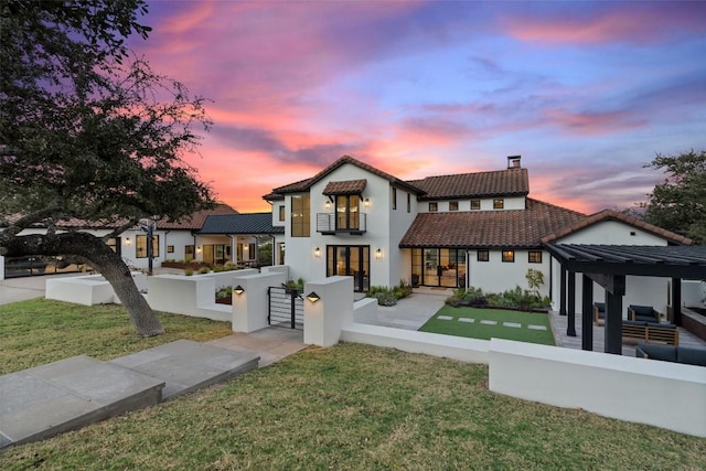 mediterranean / spanish-style house featuring a lawn