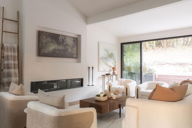 living room featuring vaulted ceiling with beams