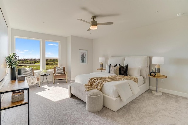 bedroom with light carpet and ceiling fan