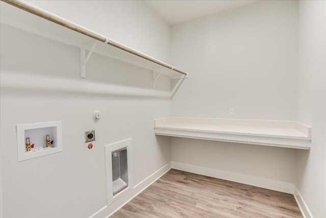 laundry room with washer hookup, light hardwood / wood-style floors, and hookup for an electric dryer