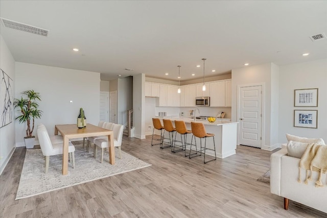 dining area featuring light hardwood / wood-style flooring