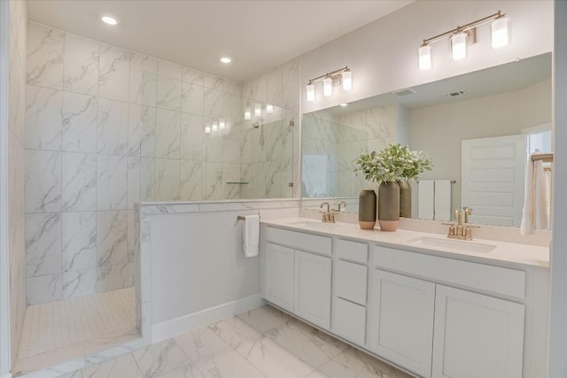 bathroom featuring vanity and a tile shower