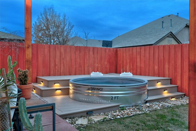 patio terrace at dusk with a deck