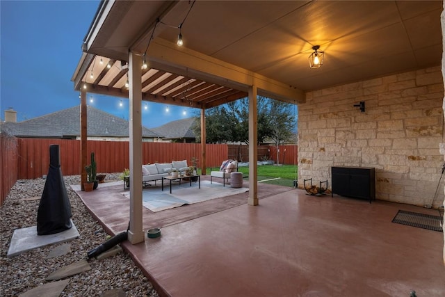 view of patio / terrace with an outdoor living space and a fenced backyard