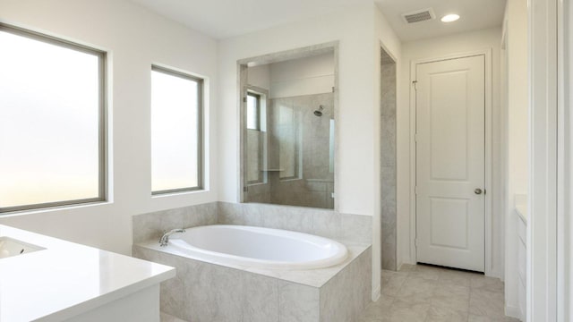 128 Spring Bluff Ln, Georgetown, TX 78628 - bathroom featuring vanity, a bath, tile patterned floors, a shower, and recessed lighting