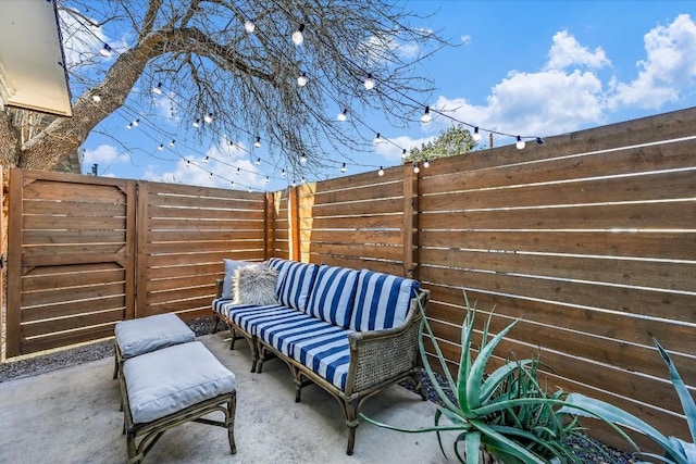 view of patio / terrace featuring fence