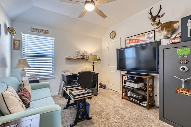 carpeted living room featuring ceiling fan and lofted ceiling