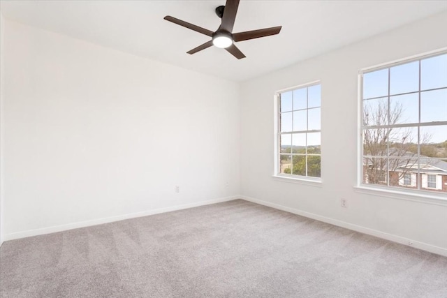 spare room with carpet and ceiling fan