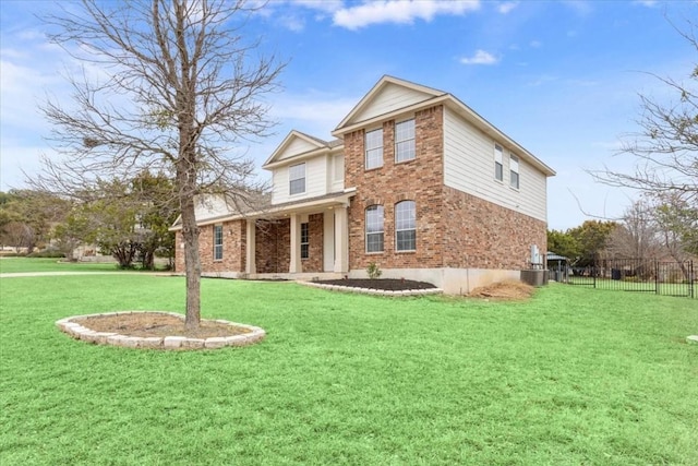 front of property with central air condition unit and a front lawn