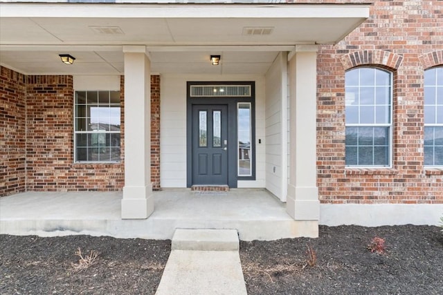 doorway to property featuring a porch