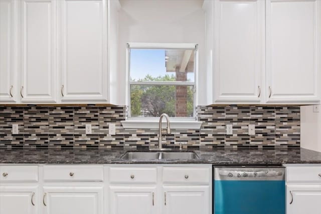 kitchen with sink, dark stone countertops, white cabinets, decorative backsplash, and stainless steel dishwasher