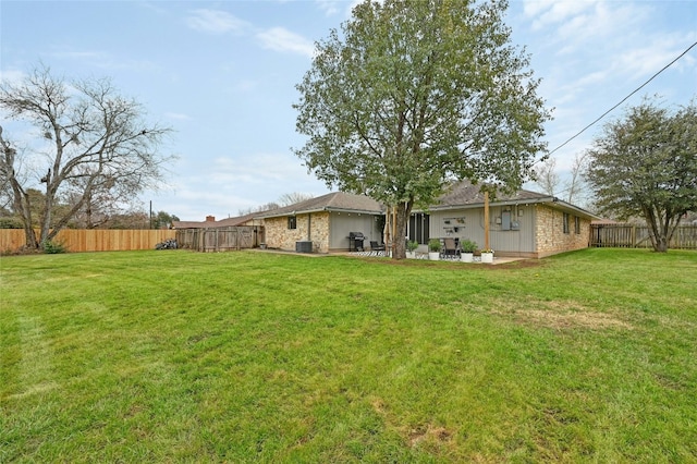 view of yard with cooling unit and a patio area