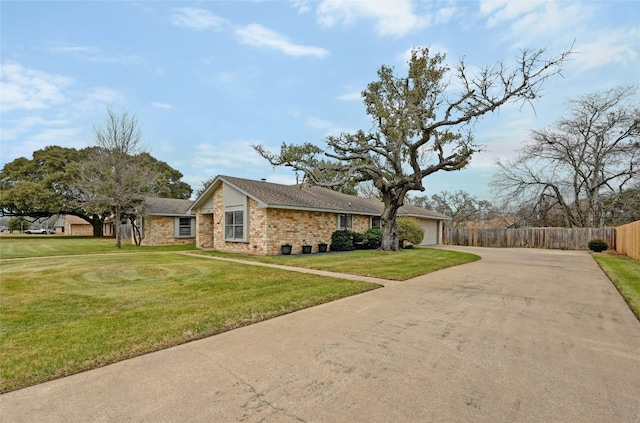 view of front of house featuring a garage and a front lawn