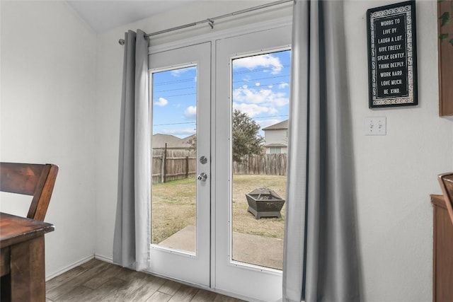 entryway featuring french doors and hardwood / wood-style flooring