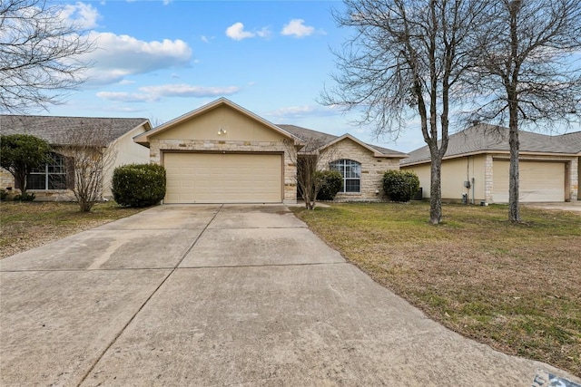 single story home featuring a garage and a front lawn