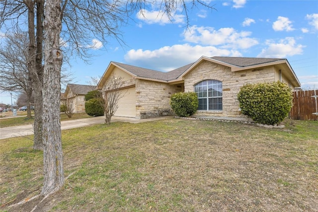 single story home with a garage and a front lawn