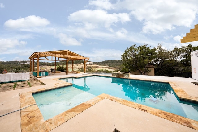 pool featuring a patio and a gazebo