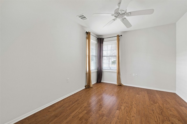 spare room featuring hardwood / wood-style flooring and ceiling fan