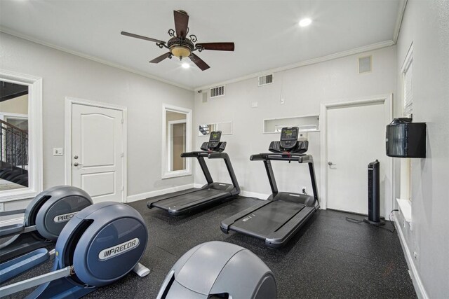 exercise area with ceiling fan, ornamental molding, visible vents, and baseboards