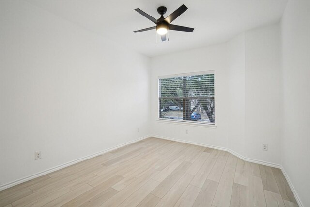 unfurnished room featuring ceiling fan and light hardwood / wood-style flooring