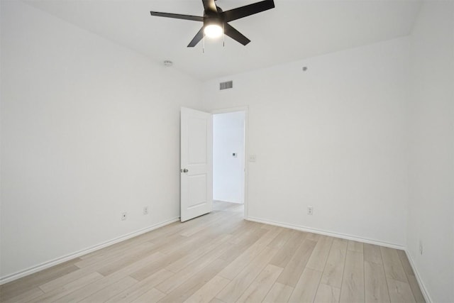 empty room featuring ceiling fan and light wood-type flooring