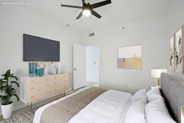 bedroom featuring a ceiling fan and visible vents