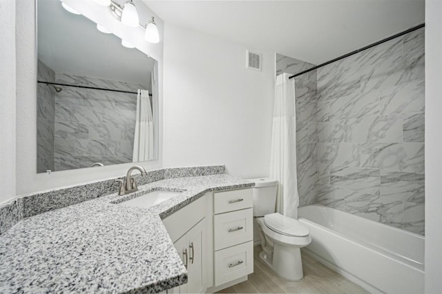 full bathroom featuring shower / bathtub combination with curtain, vanity, and toilet