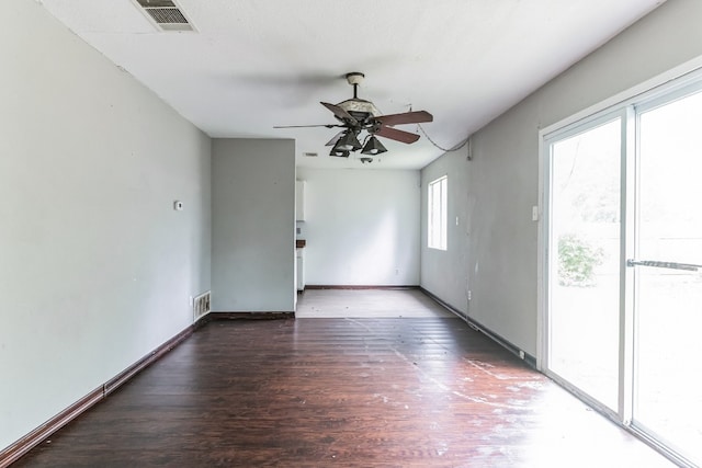 spare room featuring ceiling fan and dark hardwood / wood-style flooring