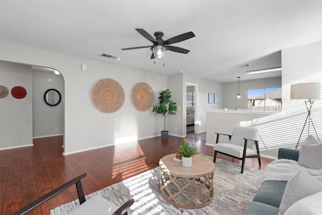 512 Mitchell Dr, Hutto, TX 78634 - living area with ceiling fan, wood-type flooring, and arched walkways