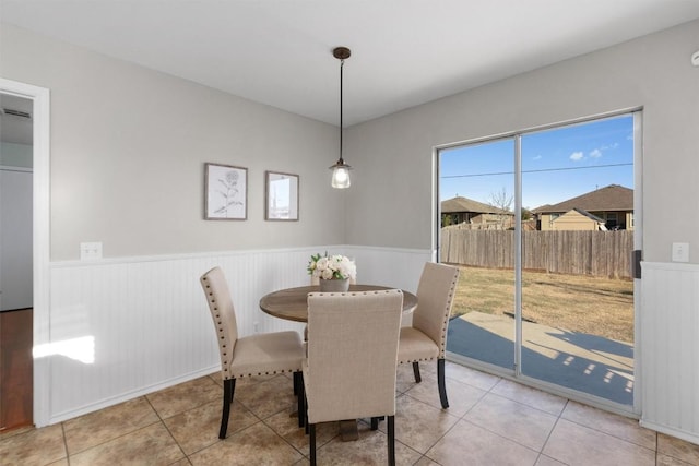 dining space featuring light tile patterned floors