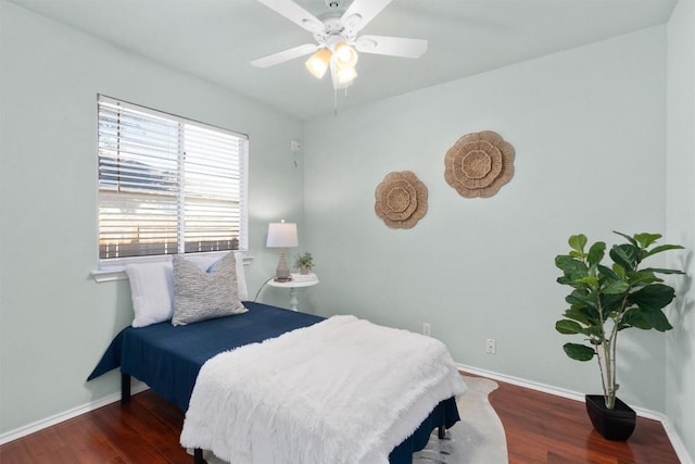 bedroom with ceiling fan and dark hardwood / wood-style floors