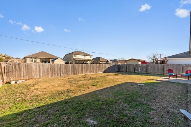 512 Mitchell Dr, Hutto, TX 78634 - fenced backyard featuring a patio and a residential view