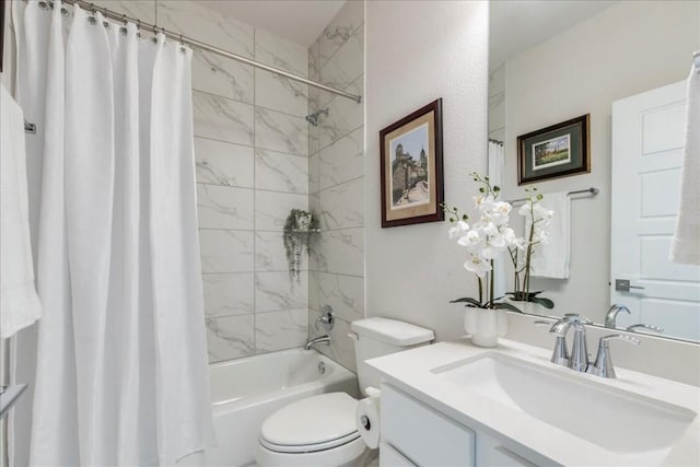 full bathroom with shower / bath combo, vanity, and toilet