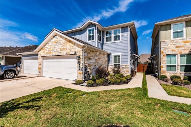 view of front of property with a garage and a front yard