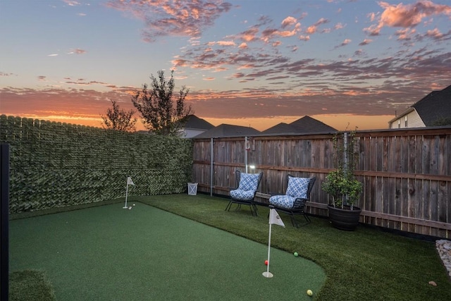 view of yard at dusk